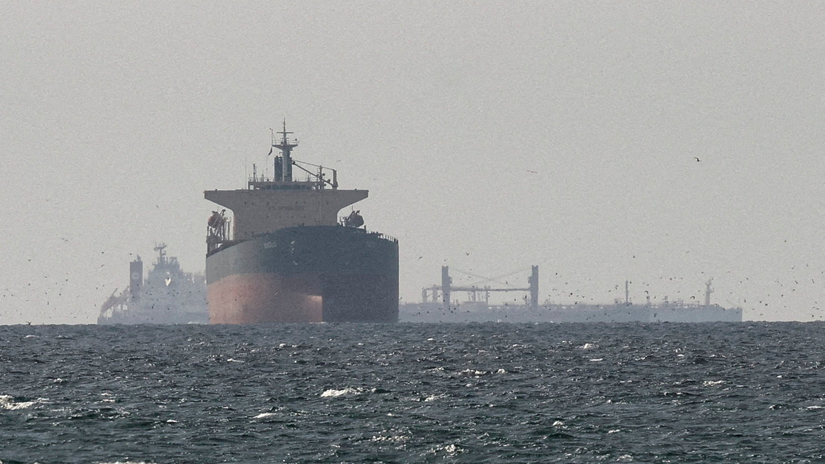 FILE PHOTO: Cargo ships in the Gulf, near the Strait of Hormuz, as seen from northern Ras al-Khaimah, near the border with Oman’s Musandam governance in United Arab Emirates, March 11, 2026. REUTERS/Stringer/File Photo