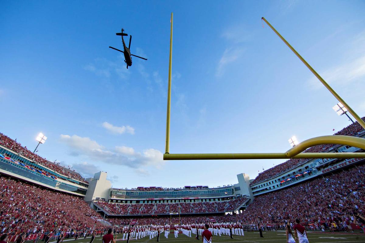  FAYETTEVILLE, AR - SEPTEMBER 17: UH-60 Black Hawk helicopters do a flyover before a game between the Arkansas Razorbacks and the Texas State Bobcats at Razorback Stadium on September 17, 2016 in Fayetteville, Arkansas. The Razorbacks defeated the Bobcats 42-3. (Photo by Wesley Hitt/Getty Images) 