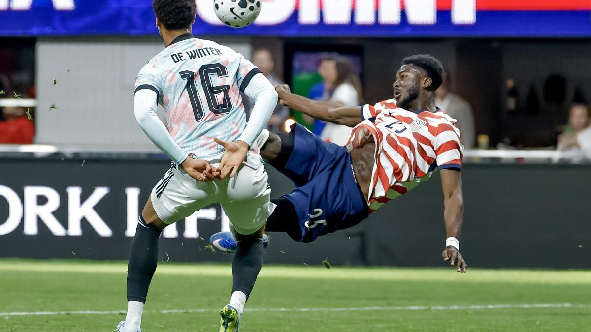 Patrick Agyemang, right, of the United States takes a shot on goal against Koni De Winter of Belgium during the international friendly match in March between the USMNT and Belgium in Atlanta, Ga. On Wednesday, Belgium denied a U.S. demand to impose strict entry bans on Congolese travelers before the World Cup. File Photo by Erik S. Lesser/EPA