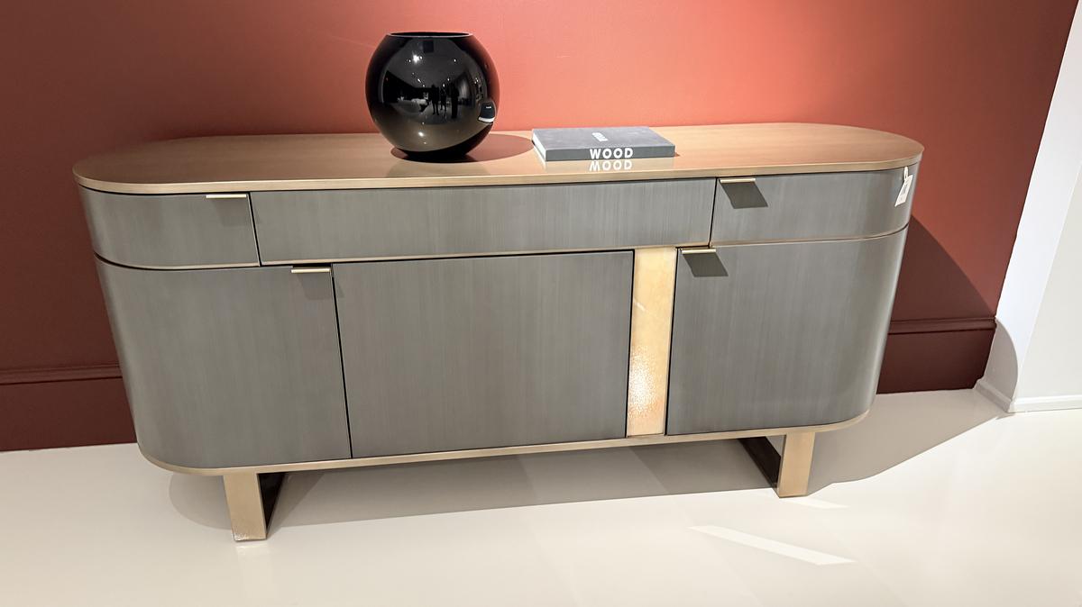 An elegant sideboard is shown in a two-tone finish. (Handout/TNS)
