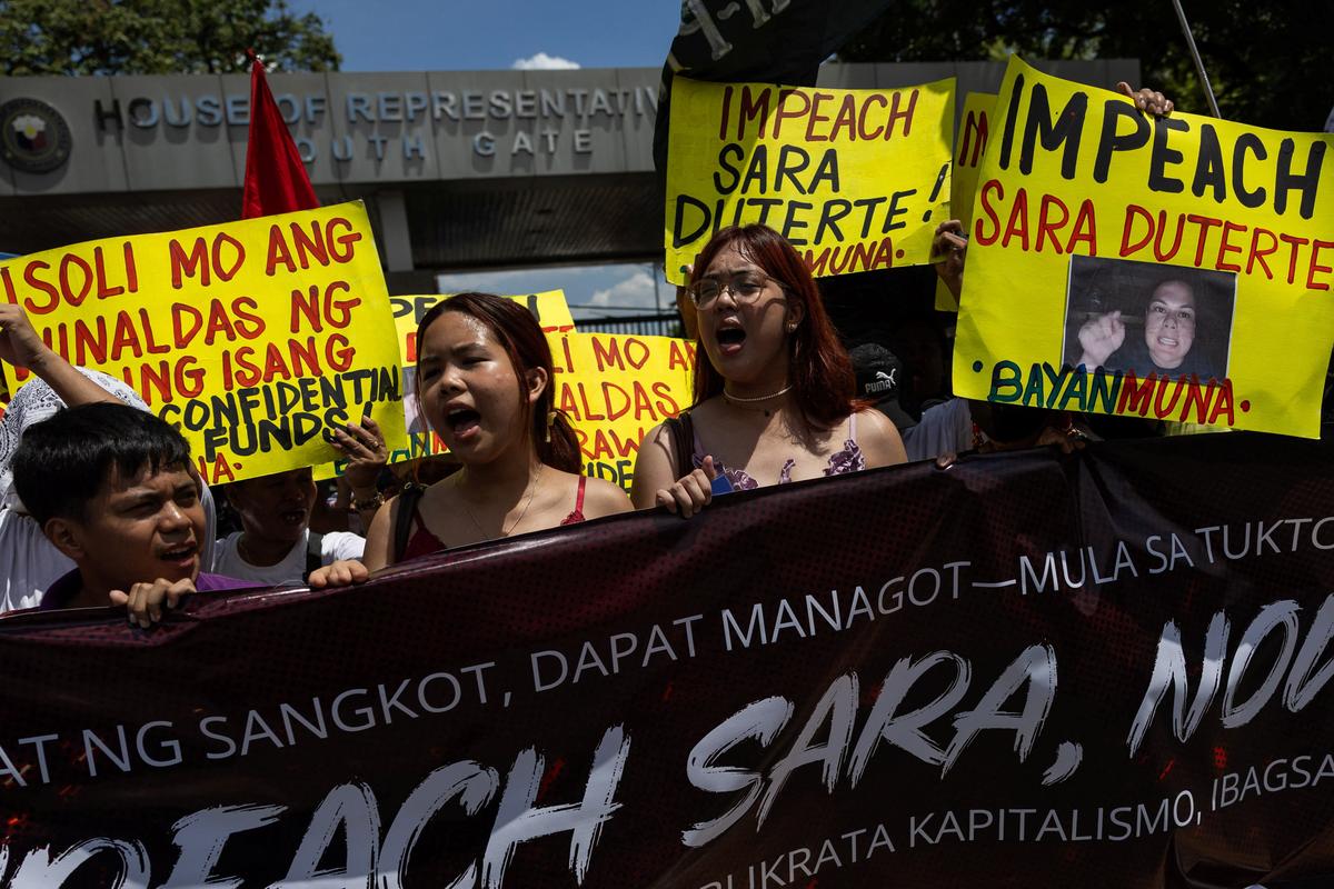 Protesters call for the impeachment of Philippine Vice President Sara Duterte ahead of a vote in the House of Representatives on whether to transmit the impeachment complaint to the Senate, outside the House of Representatives in Quezon City, Philippines, May 11, 2026. REUTERS/Eloisa Lopez