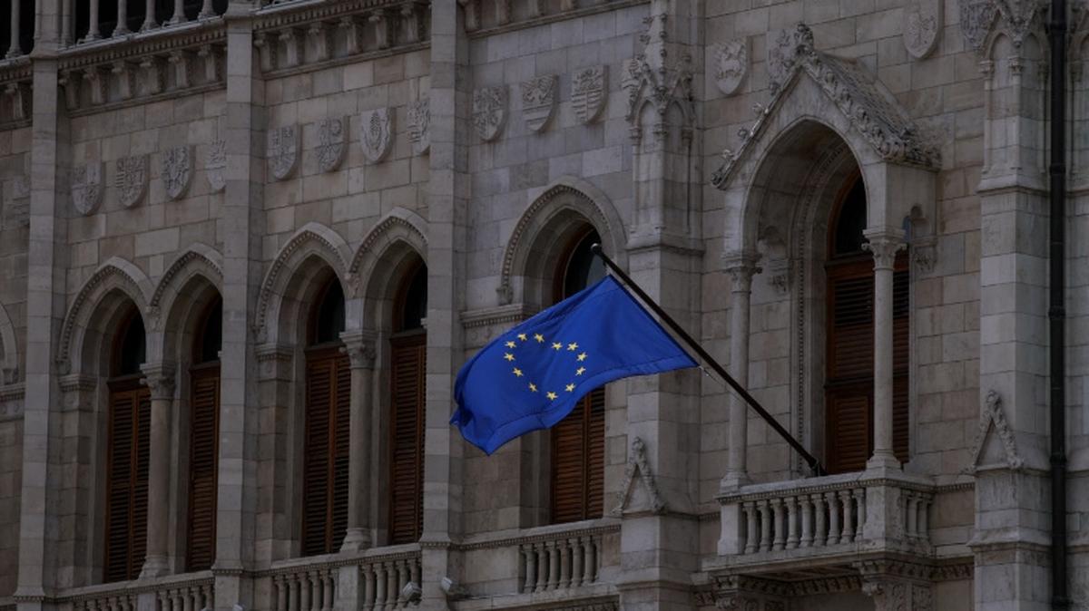 A flag of the European Union flutters from the facade of the Hungarian Parliament, on the day Prime Minister-elect Peter Magyar takes his oath of office and the inaugural session of the parliament, in Budapest, Hungary, May 9, 2026. REUTERS/Leonhard Foeger