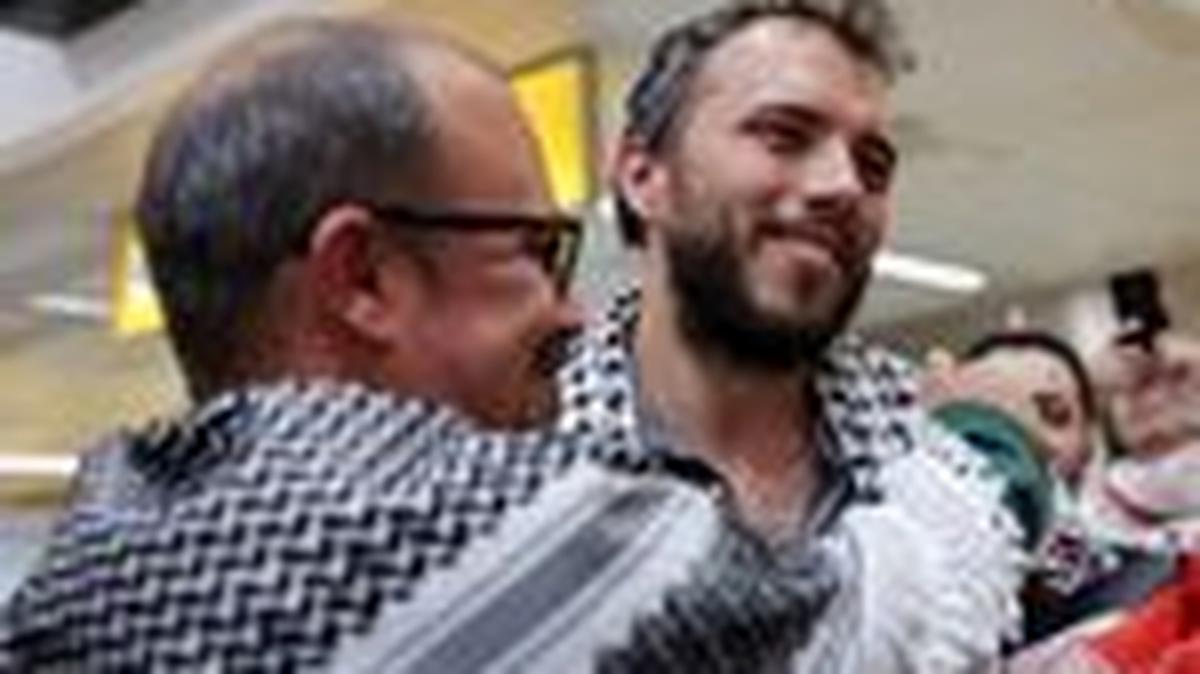 Brazilian activist Thiago Avila, who was detained aboard the Gaza-bound Global Sumud Flotilla, which was intercepted by Israeli forces, is embraced as he arrives at Sao Paulo/Guarulhos International Airport after being deported, in Guarulhos, Brazil, May 11, 2026. REUTERS/Amanda Perobelli