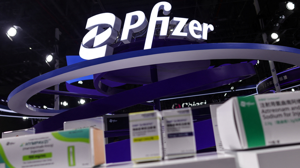 A logo of Pfizer is seen next to its products on display at the company’s booth at the 8th China International Import Expo (CIIE) in Shanghai, China, November 6, 2025.REUTERS/Maxim Shemetov