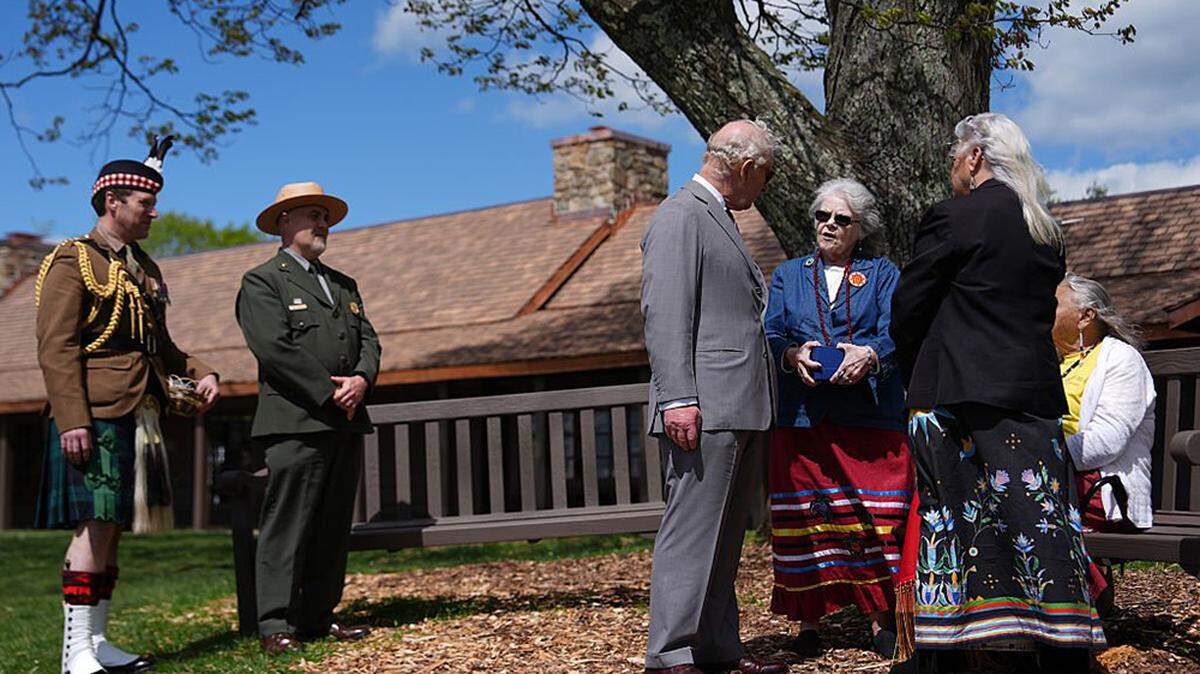 Britain's King Charles III talks with Diane Shields, chief of the Monacan Indian Nation, center, as he visits Shenandoah National Park on the final day of his state visit to the U.S. in Front Royal, Virginia, on Thursday.