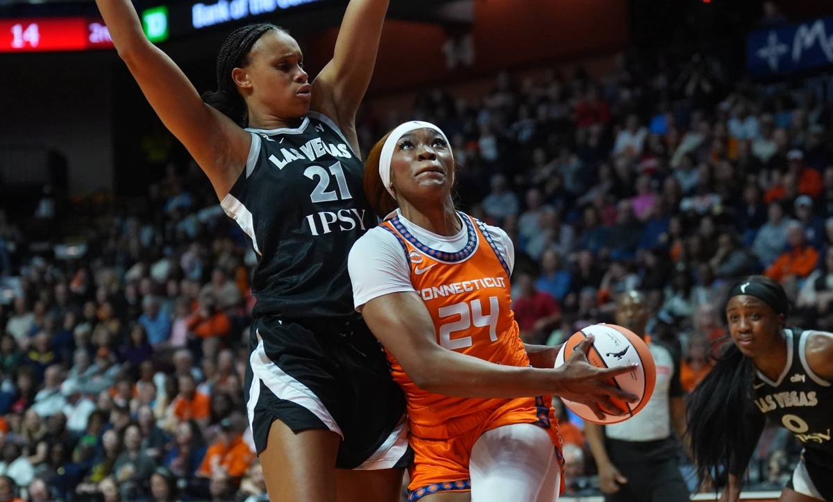  May 13, 2026; Uncasville, Connecticut, USA; Connecticut Sun forward Aneesah Morrow (24) drives the ball against Las Vegas Aces forward Brianna Turner (21) in the first half at Mohegan Sun Arena. Mandatory Credit: David Butler II-Imagn Images 