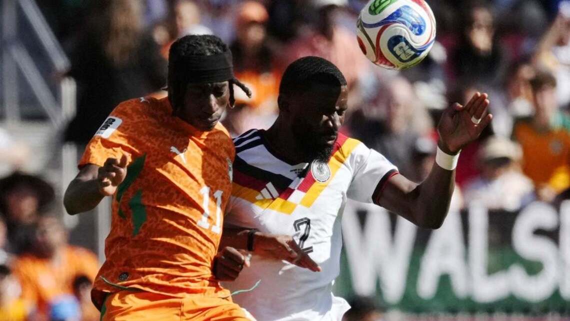 Late strike gets Germany past Ivory Coast, into knockout round