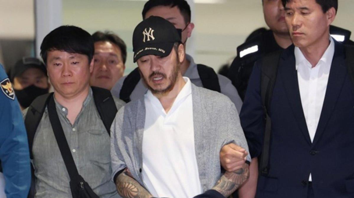Park Wang-yeol (C), a South Korean national detained in the Philippines, arrives at Incheon International Airport in Incheon, South Korea, 25 March 2026. Photo by YONHAP / EPA