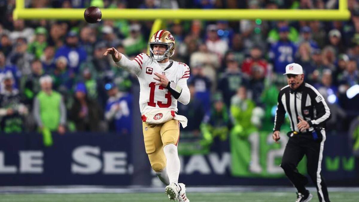  Jan 17, 2026; Seattle, WA, USA; San Francisco 49ers quarterback Brock Purdy (13) throws downfield against the Seattle Seahawks during the first half in an NFC Divisional Round game at Lumen Field. Mandatory Credit: Kevin Ng-Imagn Images | Kevin Ng-Imagn Images 