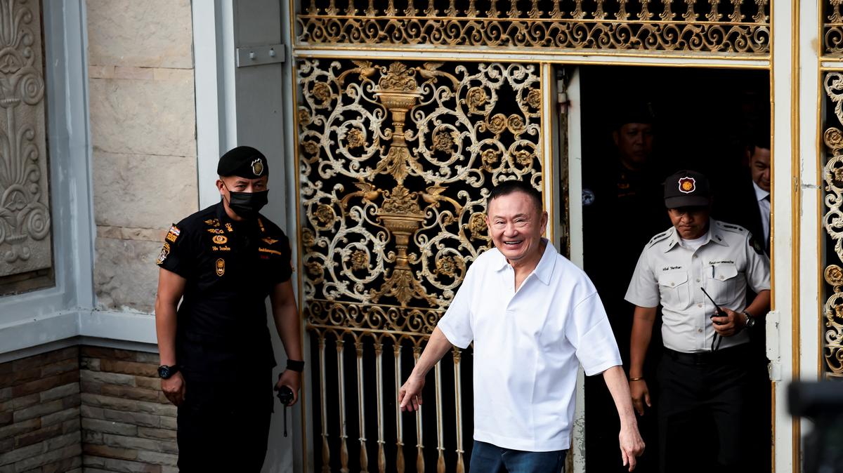 Former Thai Prime Minister Thaksin Shinawatra reacts following his release on parole after serving eight months of his one-year sentence at Klong Prem Central Prison, in Bangkok, Thailand, May 11, 2026. REUTERS/Chalinee Thirasupa