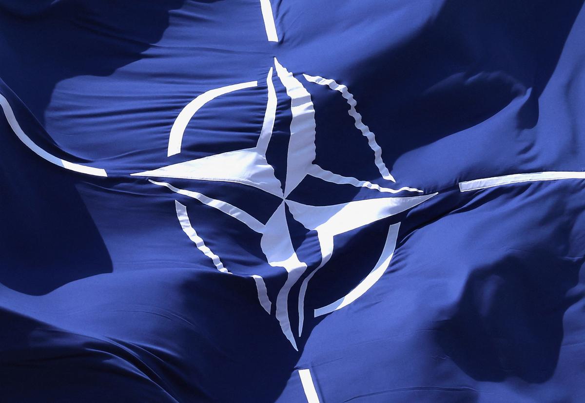 A NATO flag flutters at NATO headquarters in Brussels, Belgium April 2, 2025. REUTERS/Yves Herman