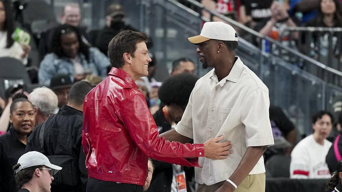  May 9, 2026; Las Vegas, Nevada, USA; Las Vegas Aces part-owner Tom Brady (left) and NBA player Bam Adebayo talk before the game between the Las Vegas Aces and the in the first quarter of their game at T-Mobile Arena. Mandatory Credit: Candice Ward-Imagn Images | Candice Ward-Imagn Images 
