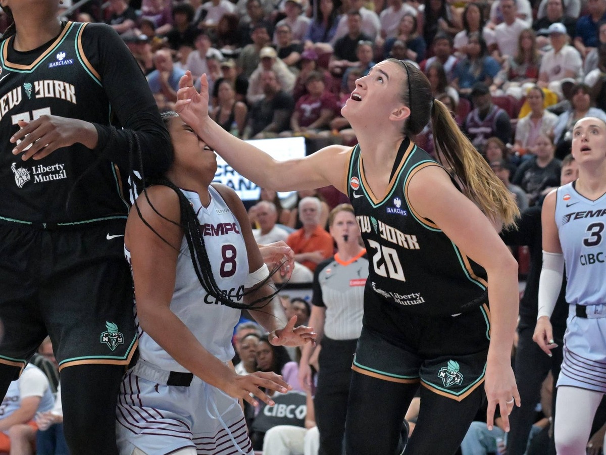  New York Liberty guard Sabrina Ionescu (20) fouls Toronto Tempo forward Nyara Sabally (8) during the second half at the Bell Centre. Eric Bolte-Imagn Images via Reuters Connect