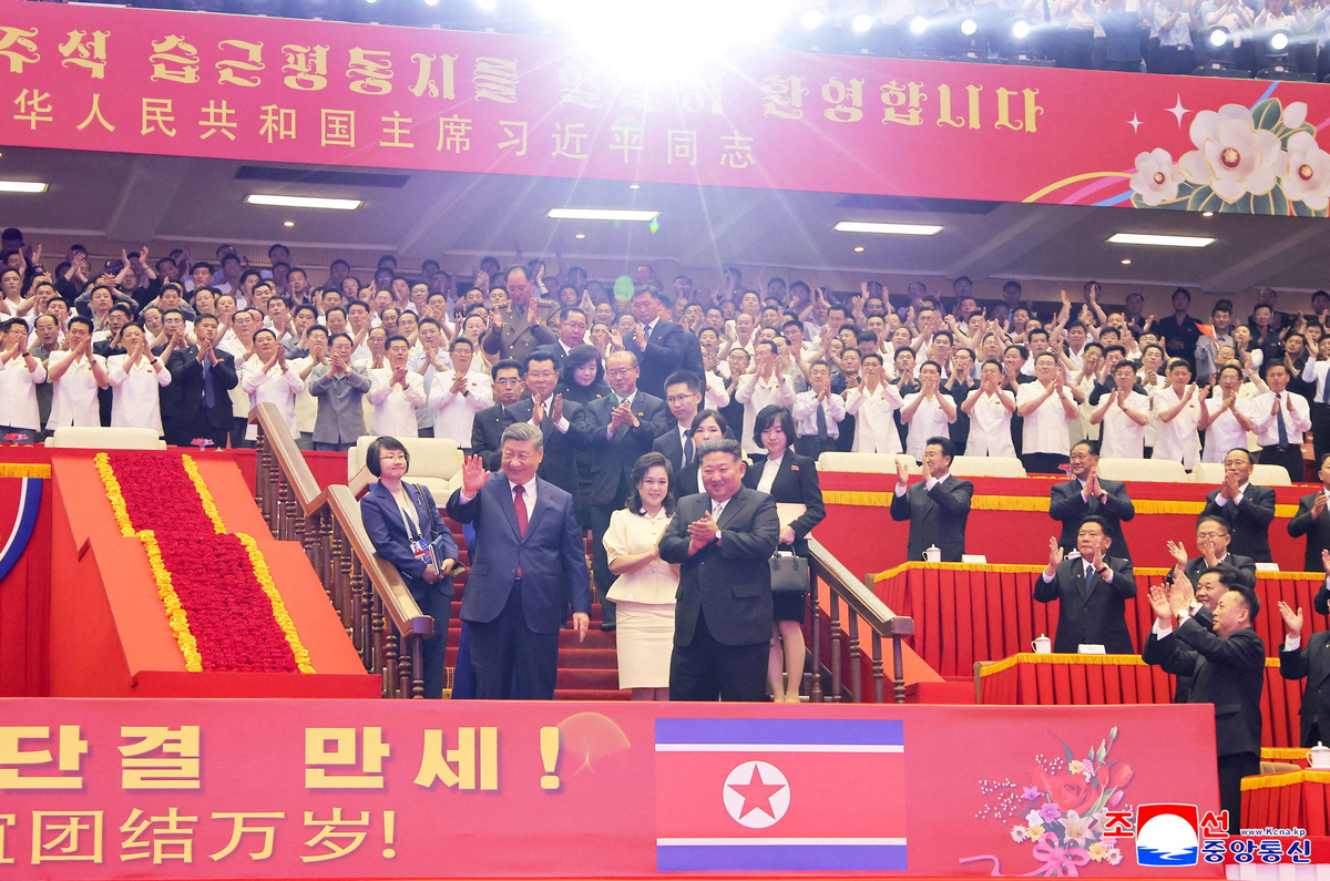 Chinese President Xi Jinping and North Korean leader Kim Jong Un attend a performance at the Pyongyang Indoor Stadium, during Xi's state visit, in Pyongyang, North Korea, June 8, 2026, in this picture released by North Korea's official Korean Central News Agency.   KCNA via REUTERS