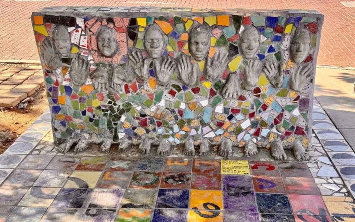 The back of a mosaic bench faces a Lubbock sidewalk. Sitting sides faces the street. Photo credit: Christine Tibbetts 