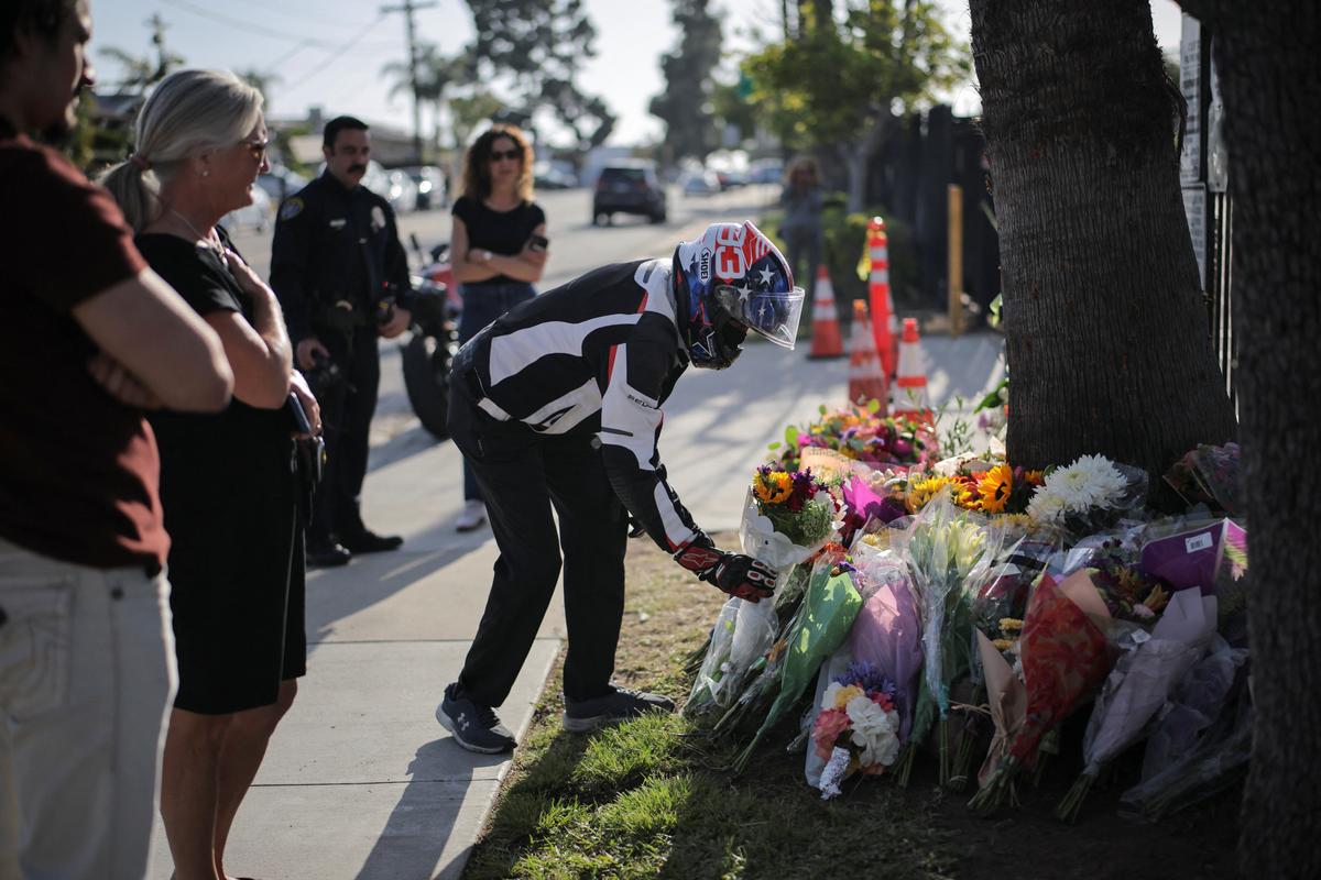 A motorcyclist pays their respects, outside the Islamic Centre of San Diego, the day after a shooting incident, in San Diego, California, U.S, May 19, 2026. REUTERS/Daniel Cole
