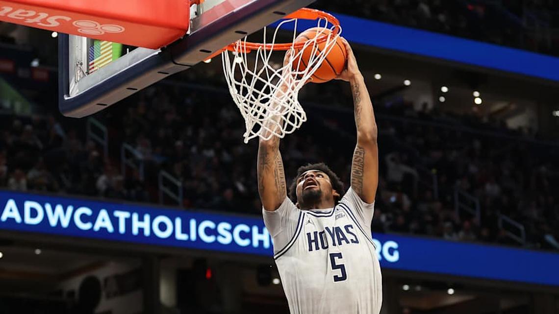  Jan 17, 2026; Washington, District of Columbia, USA; Georgetown Hoyas guard KJ Lewis (5) dunks during the first half against the UConn Huskies at Capital One Arena. Mandatory Credit: Daniel Kucin Jr.-Imagn Images | Daniel Kucin Jr.-Imagn Images 
