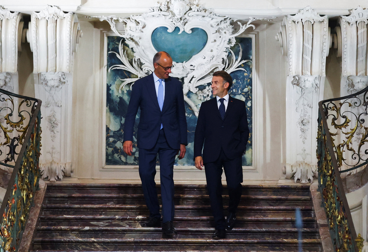 German Chancellor Friedrich Merz and French President Emmanuel Macron arrive for a press conference at Schloss Augustusburg in Bruehl, Germany, July 17, 2026. REUTERS/Thilo Schmuelgen