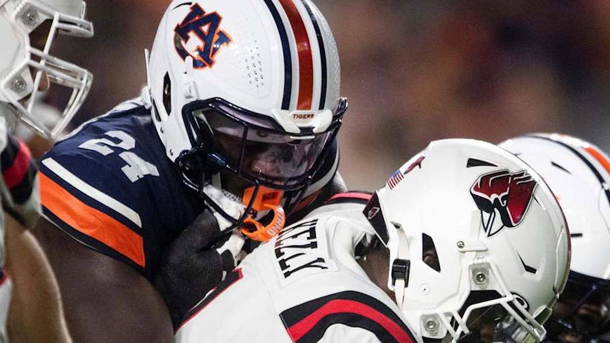  Auburn Tigers buck Keyron Crawford (24) sacks Ball State Cardinals quarterback Kiael Kelly (1) as Auburn Tigers take on Ball State Cardinals at Jordan-Hare Stadium in Auburn, Ala. on Saturday, Sept. 6, 2025. Auburn Tigers lead Ball State Cardinals 21-0 at halftime. | Jake Crandall/ Advertiser / USA TODAY NETWORK via Imagn Images 