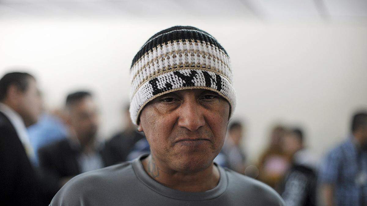 Carlos Mojica Lechuga, founder and leader of the Barrio 18 gang, takes part in a news conference at La Esperanza Penitentiary in San Salvador, El Salvador, on Jan. 19, 2013. Mojica, who had been in a maximum-security prison since 2003 for ordering dozens of murders and faced accusations of other crimes, has died, the government announced.