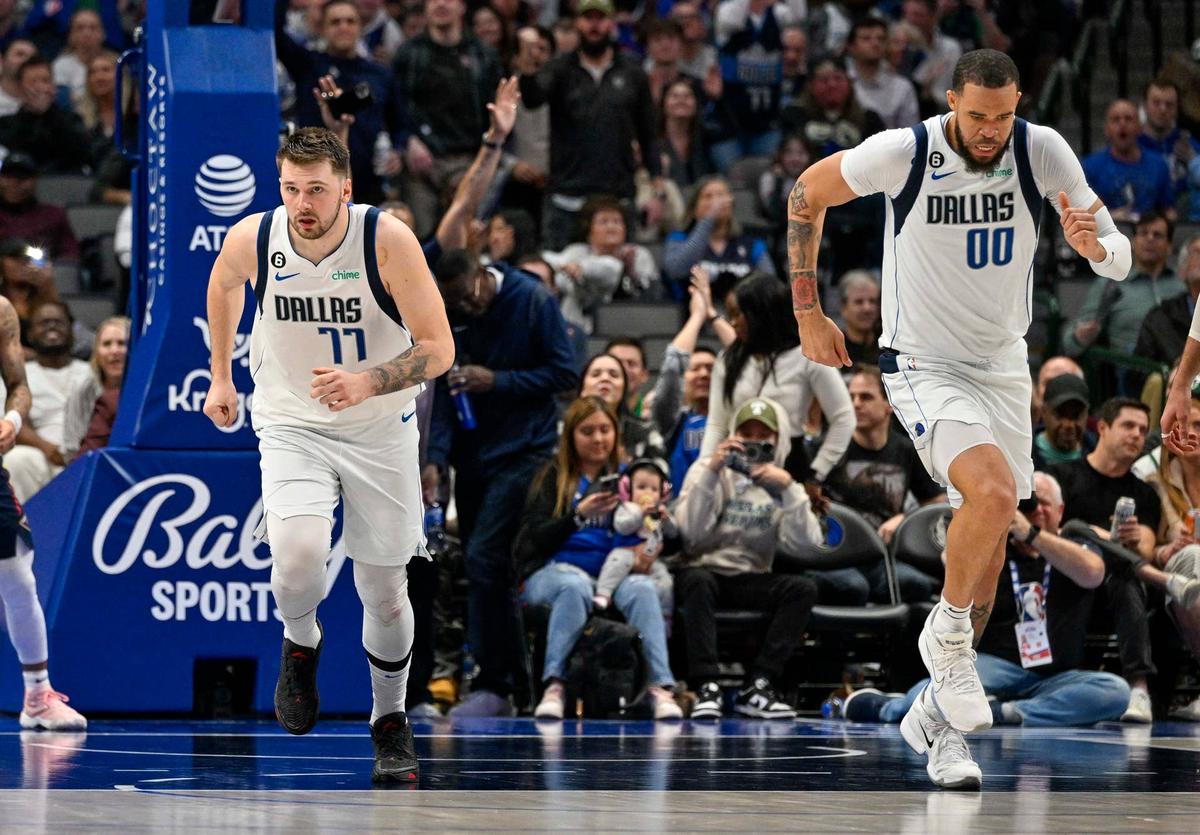  Dallas Mavericks guard Luka Doncic and center JaVale McGee run up the court after an alley oop pass at the American Airlines Center. © Jerome Miron-Imagn Images