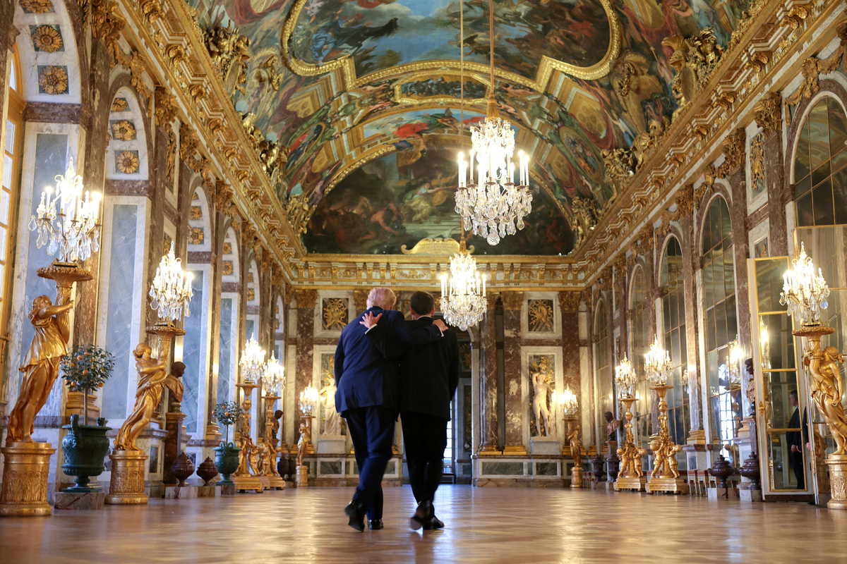 U.S. President Donald Trump receives a tour of Chateau de Versailles from President of France Emmanuel Macron ahead of a dinner on June 17, 2026. Anna Moneymaker/Pool via REUTERS