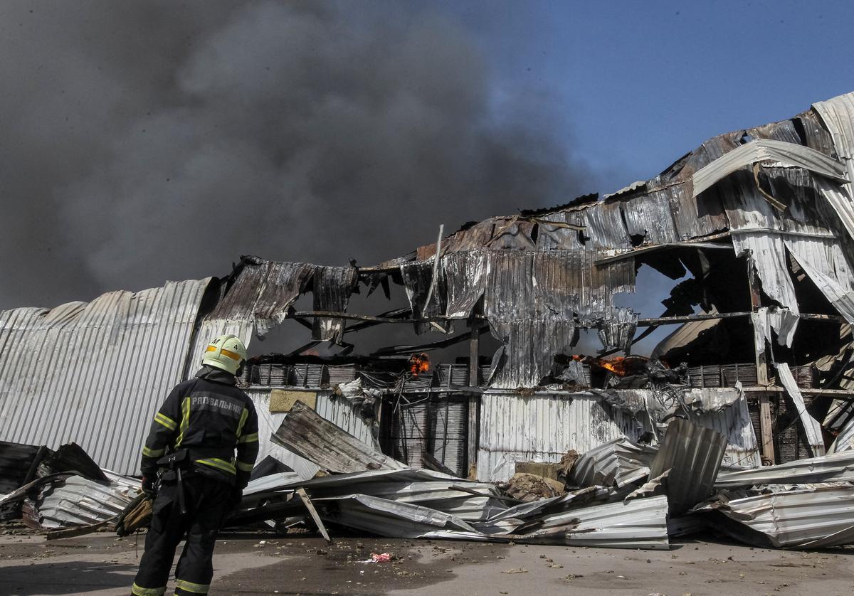 A firefighter works at a site of a Russian missile strike, amid Russia's attack on Ukraine, in Dnipro, Ukraine May 20, 2026. REUTERS/Stringer