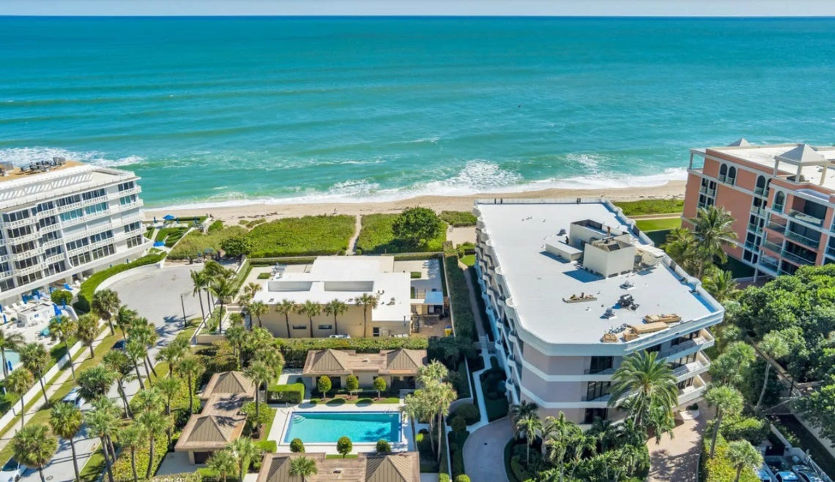 Seen to the right of the swimming pool, the east building at Leverett House stands directly on the beach in Palm Beach.