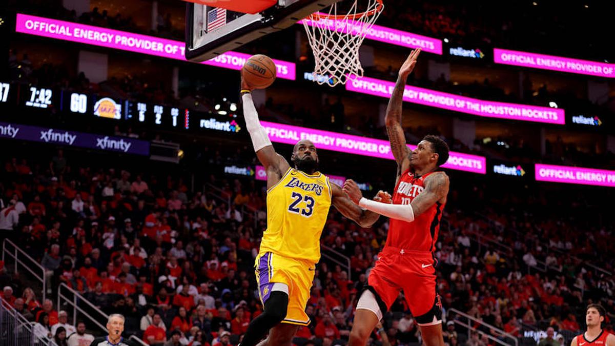  Lakers forward LeBron James looks to dunk against Rockets forward Jabari Smith Jr. during the first round of the 2026 NBA playoffs. | Erik Williams-Imagn Images 