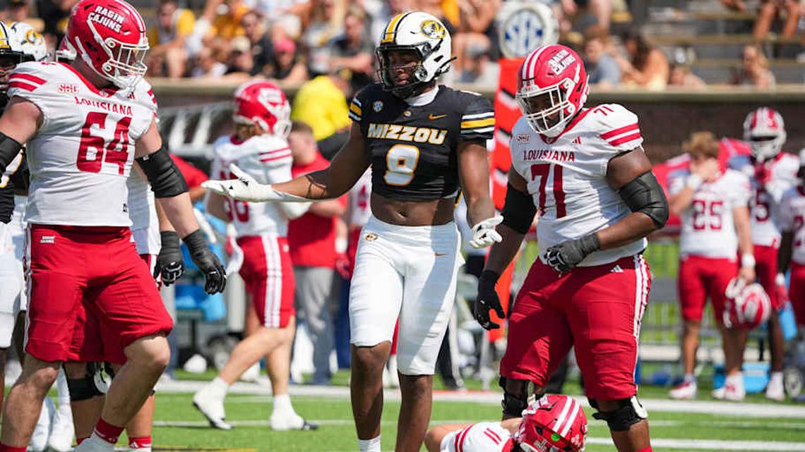  Sep 13, 2025; Columbia, Missouri, USA; Missouri Tigers defensive end Zion Young (9) celebrates after sacking Louisiana-Lafayette Ragin Cajuns quarterback Daniel Beale (11) during the second half of the game at Faurot Field at Memorial Stadium. Mandatory Credit: Denny Medley-Imagn Images | Denny Medley-Imagn Images 
