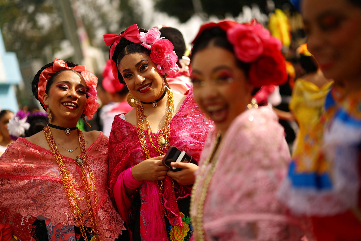 Soccer Football - FIFA World Cup 2026 - Group A - Mexico v South Africa - Estadio Azteca, Mexico City, Mexico - June 11, 2026 Mexico fans wear traditional clothing outside the stadium before the match REUTERS/Hannah Mckay