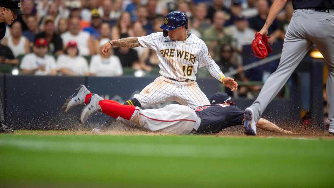 Milwaukee Brewers’ Kolten Wong (16) scores during the fifth inning of the team’s baseball game against the Washington Nationals, Saturday, Aug. 21, 2021, in Milwaukee. (AP Photo/Michael R. Schmidt)