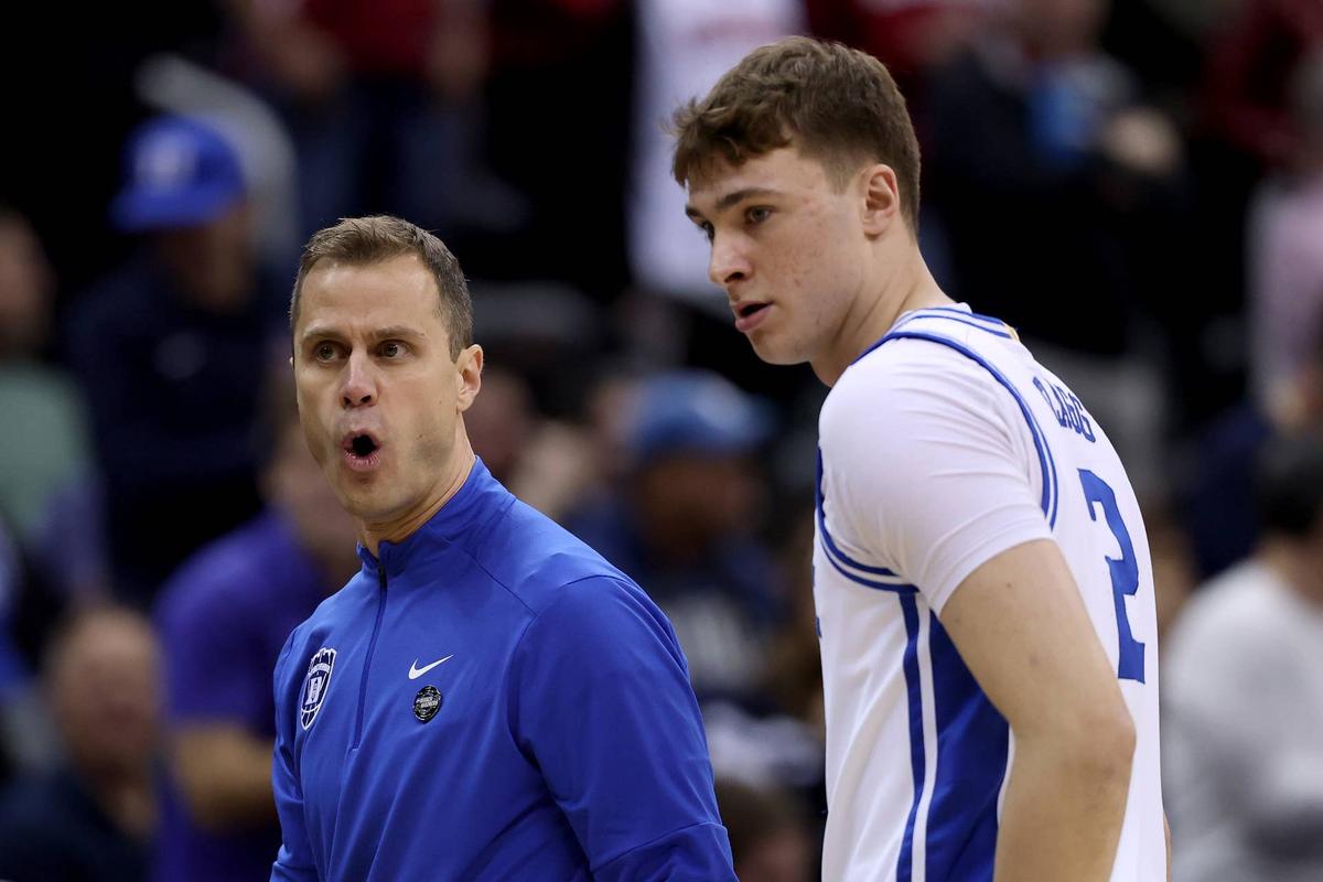  NEWARK, NEW JERSEY - MARCH 29: Head coach Jon Scheyer of the Duke Blue Devils reacts alongside Cooper Flagg #2 against the Alabama Crimson Tide during the first half in the East Regional Elite Eight round of the NCAA Men's Basketball Tournament at Prudential Center on March 29, 2025 in Newark, New Jersey. (Photo by Patrick Smith/Getty Images) 