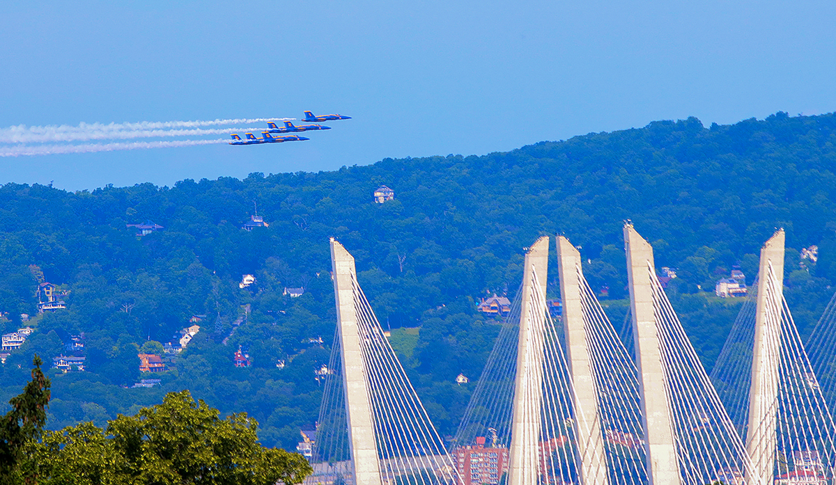 The Navy Blue Angels fly over the Mario Cuomo bridge as they head up the Hudson River in Tarrytown, N.Y., July 4, 2026. America celebrates the 250th anniversary of its independence today, with people from one end of the country to the other marking the milestone with fireworks, parades and concerts. (Jose R. Lopez/The New York Times)