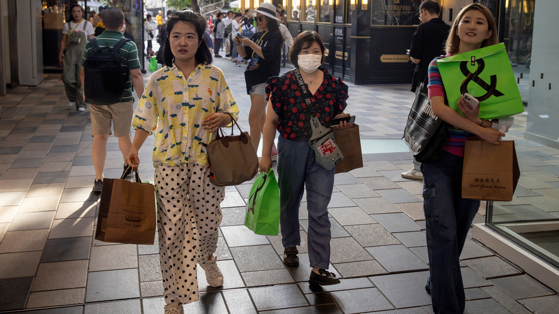 China's industrial output growth quickens in May but retail sales and investment contract 