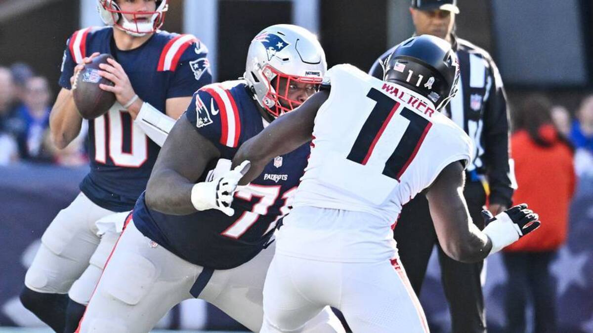  Nov 2, 2025; Foxborough, Massachusetts, USA; New England Patriots offensive tackle Mike Onwenu (71) blocks Atlanta Falcons linebacker Jalon Walker (11) during the first half at Gillette Stadium. Mandatory Credit: Eric Canha-Imagn Images | IMAGN IMAGES via Reuters Connect 