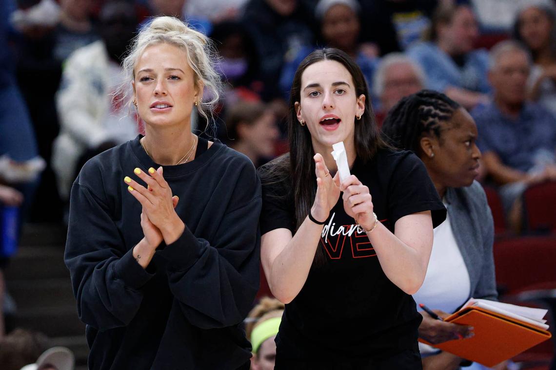  Indiana Fever guards Sophie Cunningham and Caitlin Clark react from the bench during a game. Kamil Krzaczynski-Imagn Images