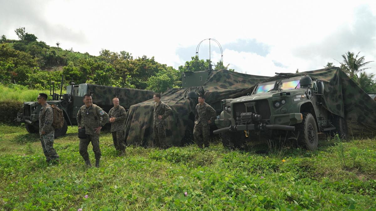 Philippine and U.S. military personnel stand beside vehicles and equipment used for the Navy-Marine Expeditionary Ship Interdiction System (NMESIS) anti-ship missile system during joint military exercises in Basco, Batanes province, Philippines, May 2, 2026. REUTERS/Adrian Portugal