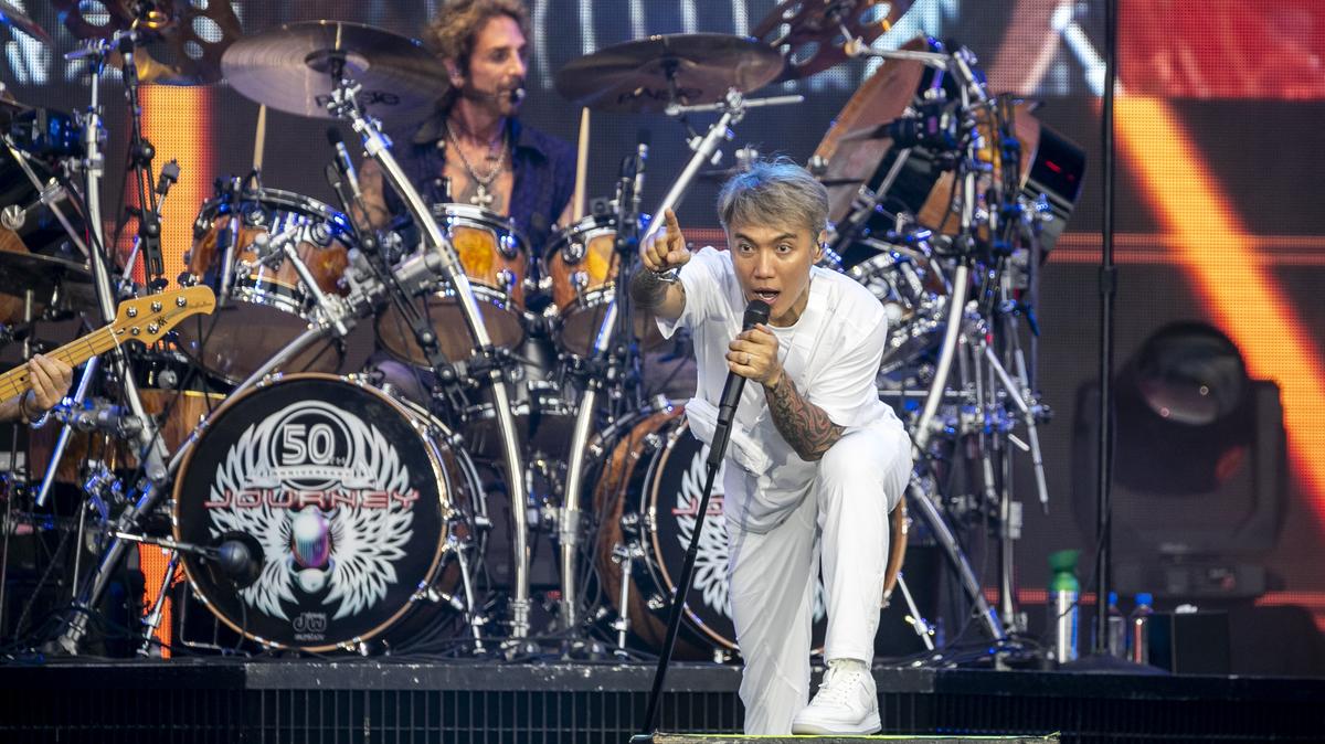 Singer Arnel Pineda and drummer Deen Castronovo of Journey perform at Camping World Stadium in Orlando on July 10, 2024. (Patrick Connolly/Orlando Sentinel)