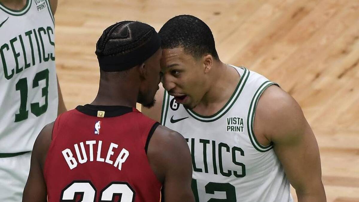  May 19, 2023; Boston, Massachusetts, USA; Miami Heat forward Jimmy Butler (22) comes together with Boston Celtics forward Grant Williams (12) after a play during the second half of game two of the Eastern Conference Finals for the 2023 NBA playoffs at TD Garden. Mandatory Credit: Bob DeChiara-Imagn Images | Bob DeChiara-Imagn Images 