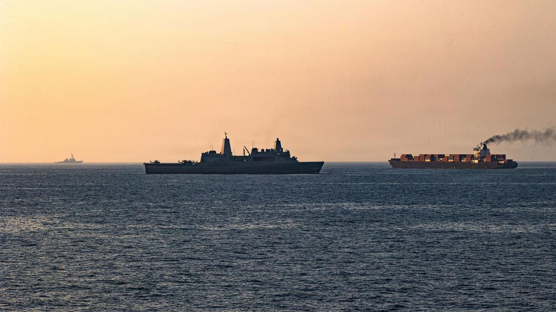 In a handout photo provided by U.S. Central Command, U.S. forces patrol the Arabian Sea near M/V Touska on April 20, 2026, after firing upon the Iranian-flagged vessel that the U.S. accused of attempting to violate the U.S. naval blockade of Iranian ports near the Strait of Hormuz. (U.S. Navy/Getty Images/TNS)