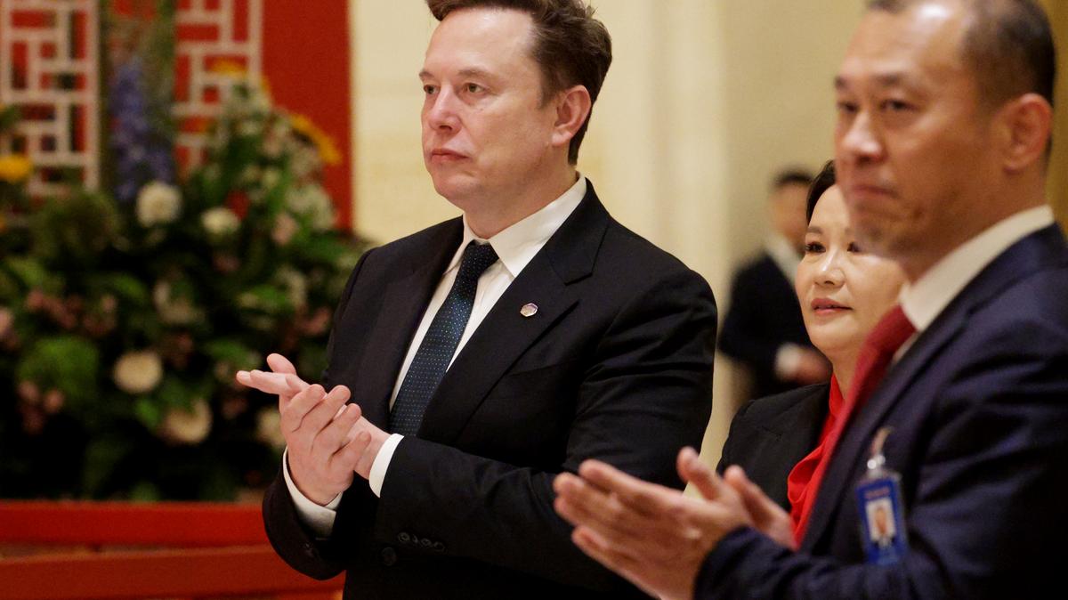U.S. President Trump Meets With China’s President Xi And Attends State Banquet. Tesla CEO Elon Musk applauds during a state banquet hosted by Chinese President Xi Jinping at the Great Hall of the People on May 14, 2026 in Beijing, China. 