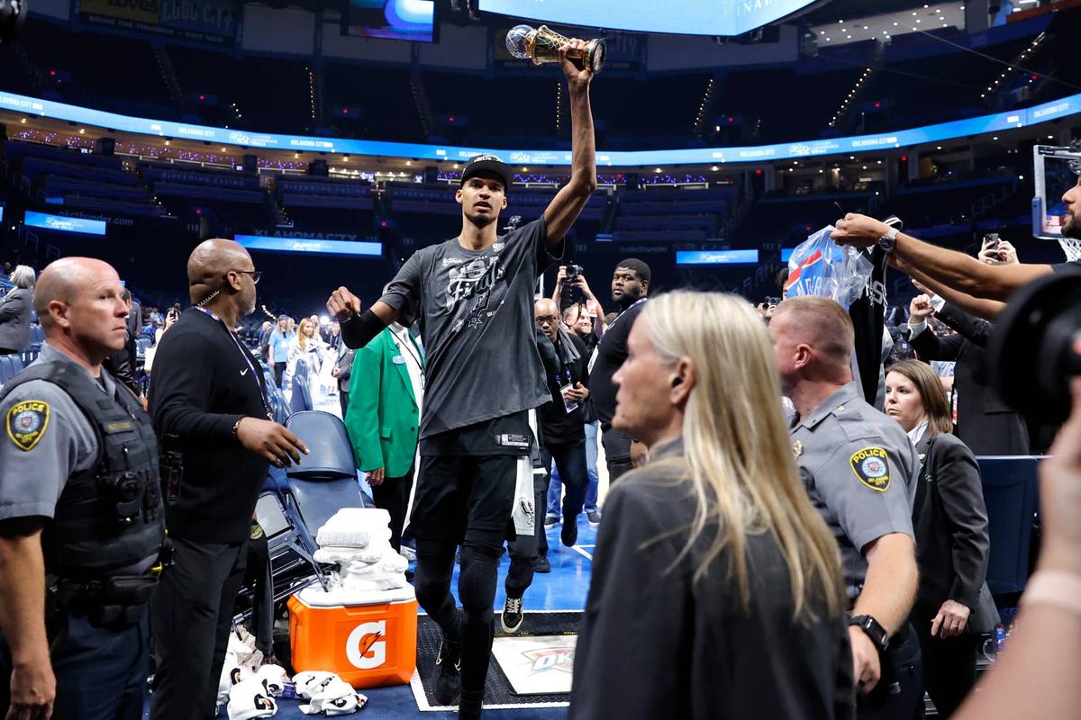  San Antonio Spurs forward Victor Wembanyama (1) celebrates with the MVP trophy after defeating the Oklahoma City Thunder 