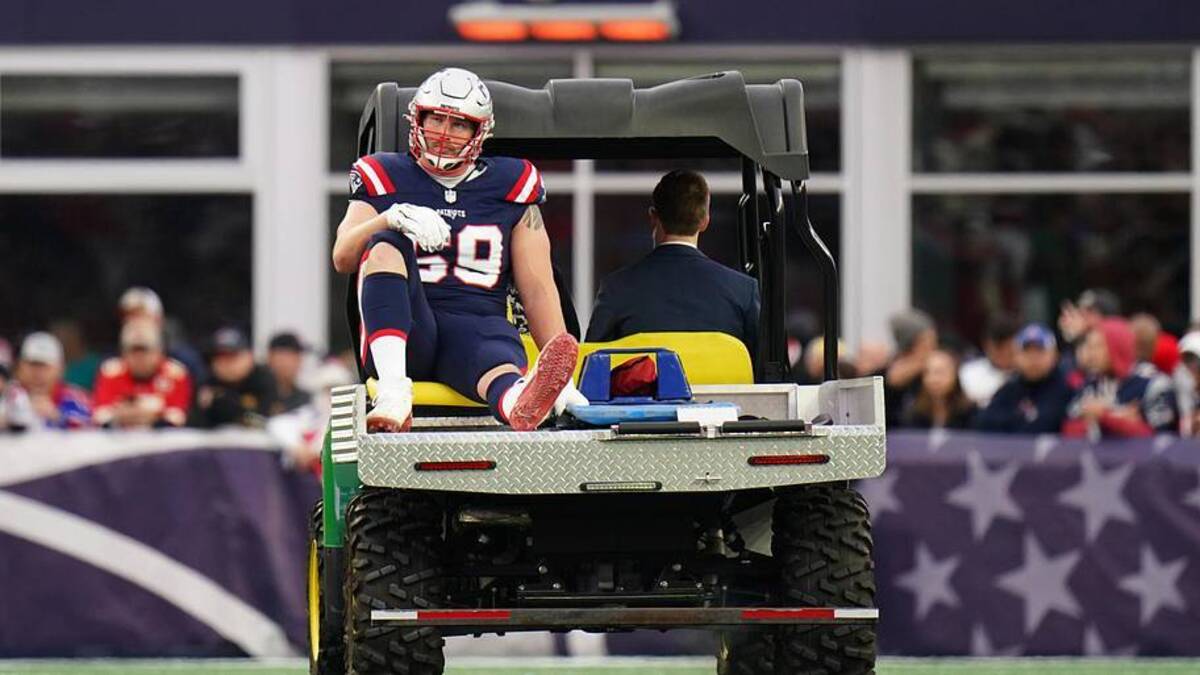  Dec 17, 2023; Foxborough, Massachusetts, USA; New England Patriots guard Cole Strange (69) is injured and helped off the field as they take on the Kansas City Chiefs at Gillette Stadium. Mandatory Credit: David Butler II-Imagn Images | David Butler II-Imagn Images 
