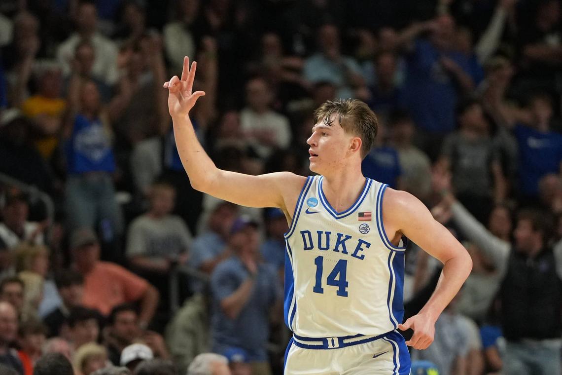  Mar 21, 2026; Greenville, SC, USA; Duke Blue Devils guard Nikolas Khamenia (14) reacts after scoring a three point basket in the second half during a second round game of the men's 2026 NCAA Tournament at Bon Secours Wellness Arena. Mandatory Credit: Bob Donnan-Imagn Images 