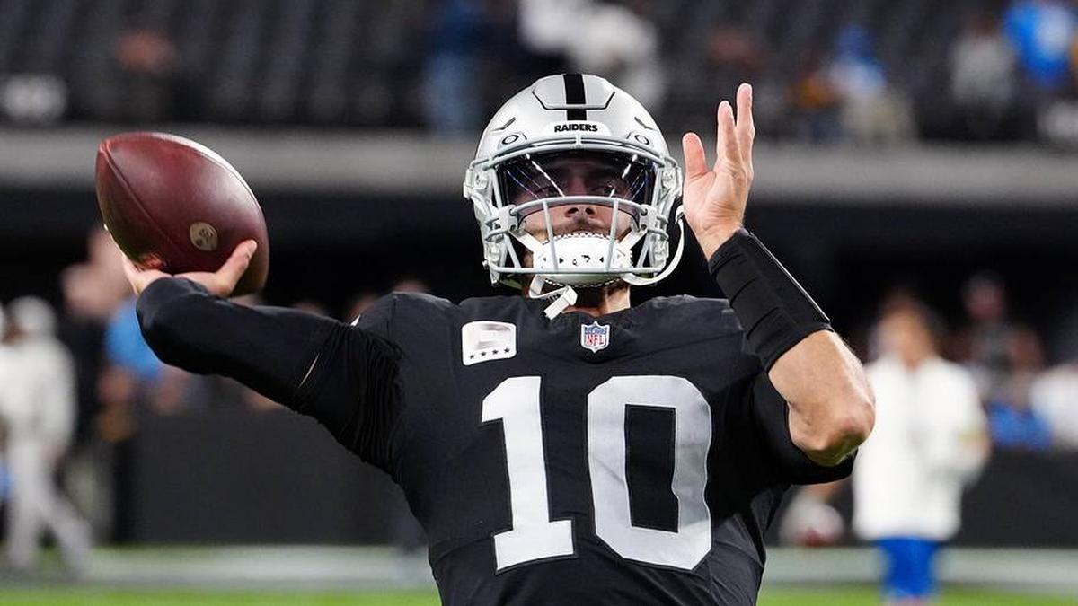  Dec 14, 2023; Paradise, Nevada, USA; Las Vegas Raiders quarterback Jimmy Garoppolo (10) warms up before the game against the Los Angeles Chargers at Allegiant Stadium. Mandatory Credit: Stephen R. Sylvanie-Imagn Images | Stephen R. Sylvanie-Imagn Images 