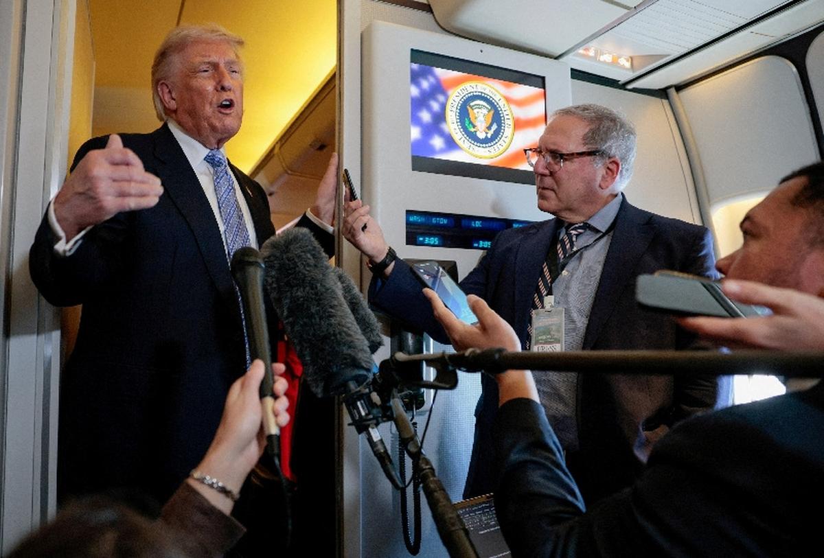 FILE PHOTO: U.S. President Donald Trump speaks to the press aboard Air Force One en route to the U.S.  following his official visit with President Xi Jinping in China, May 15, 2026. REUTERS/Evan Vucci/File Photo