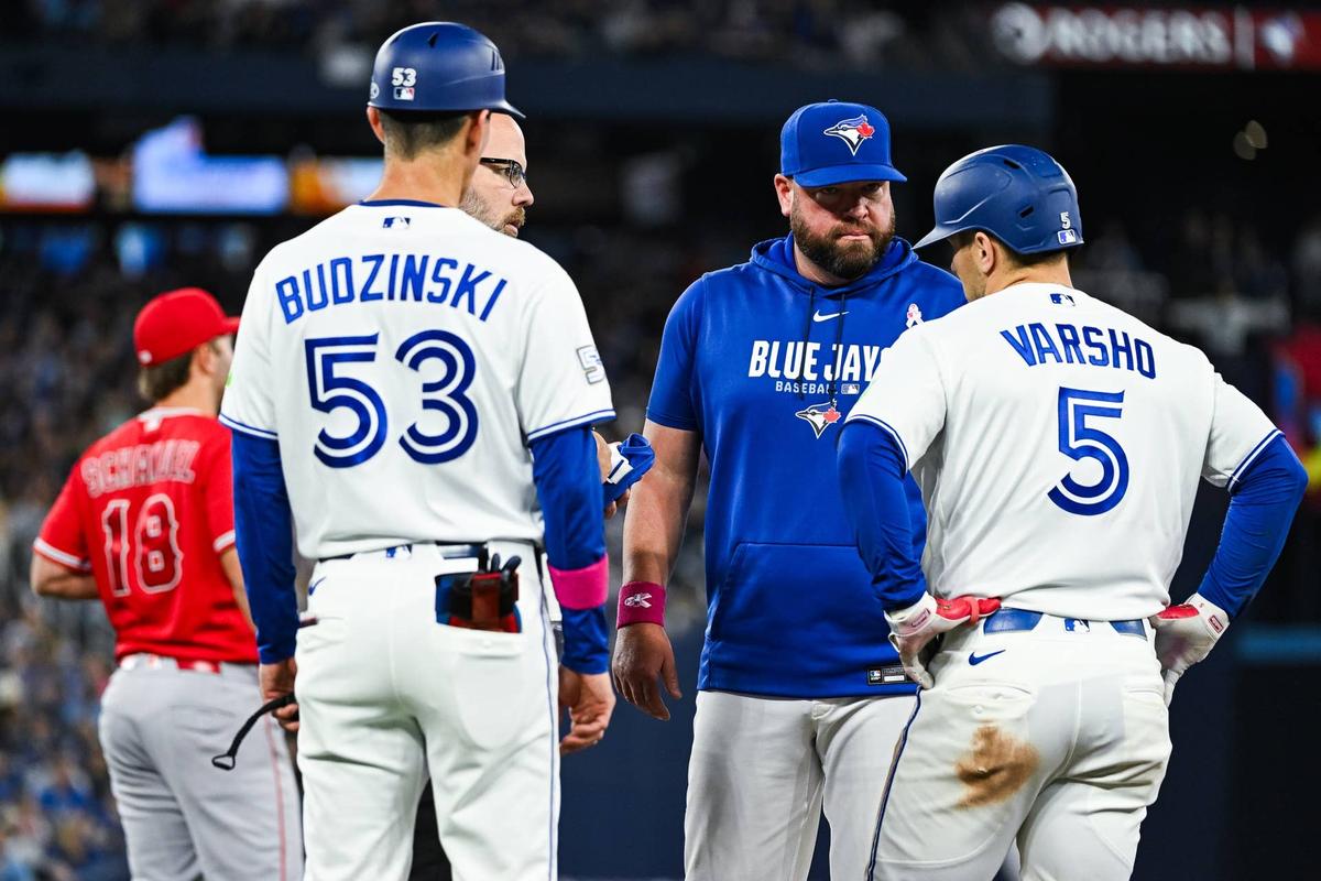  Toronto Blue Jays manager John Schneider and center fielder Daulton Varsho (5)