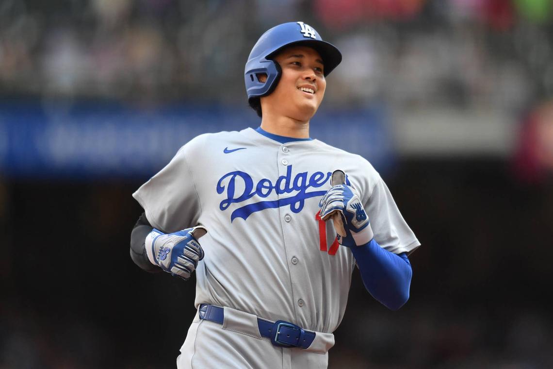  Jul 9, 2025; Milwaukee, Wisconsin, USA; Los Angeles Dodgers designated hitter Shohei Ohtani (17) smiles while base running during the seventh inning against the Milwaukee Brewers at American Family Field. Mandatory Credit: Patrick Gorski-Imagn Images 