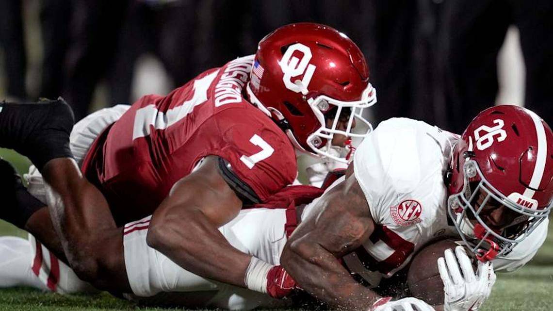  Oklahoma Sooners linebacker Sammy Omosigho (7) brings down Alabama Crimson Tide running back Jamarion Miller (26) during a first-round College Football Playoff game between the University of Oklahoma Sooners (OU) and the Alabama Crimson Tide at Gaylord Family - Oklahoma Memorial Stadium in Norman, Okla., Friday, Dec. 19, 2025. Alabama won 34-24. | BRYAN TERRY/THE OKLAHOMAN / USA TODAY NETWORK via Imagn Images 